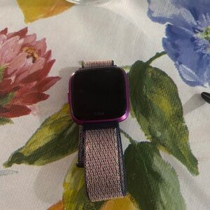 Fitbit Smartwatch with Purple Frame and Multicolor Band